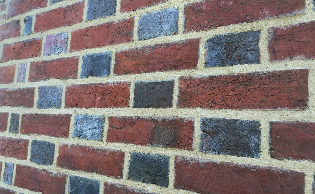 Flemish bond with blue headers in lime mortar